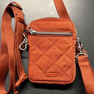 Small burnt orange crossbody bag with extra strap to make it a Fanny pack